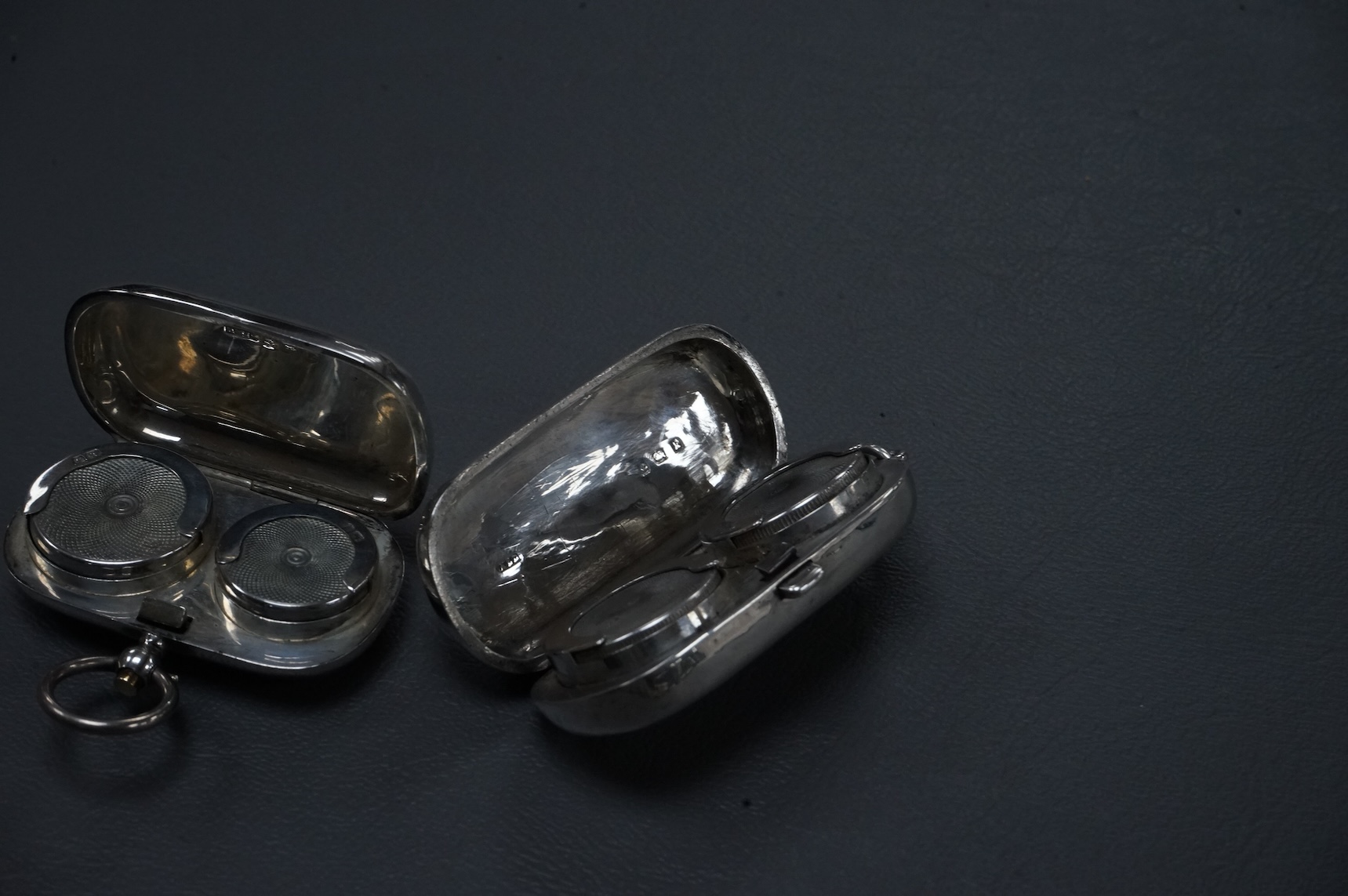 Two Edwardian twin compartment silver sovereign cases, one for sovereigns, the other for sovereign and half sovereign, both Birmingham, 1909, largest 56mm.